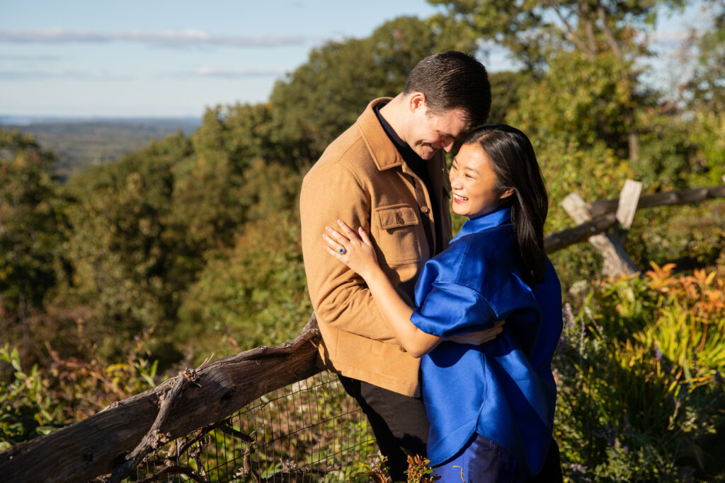 Man and woman stand on mountain in Hudson Valley eloping